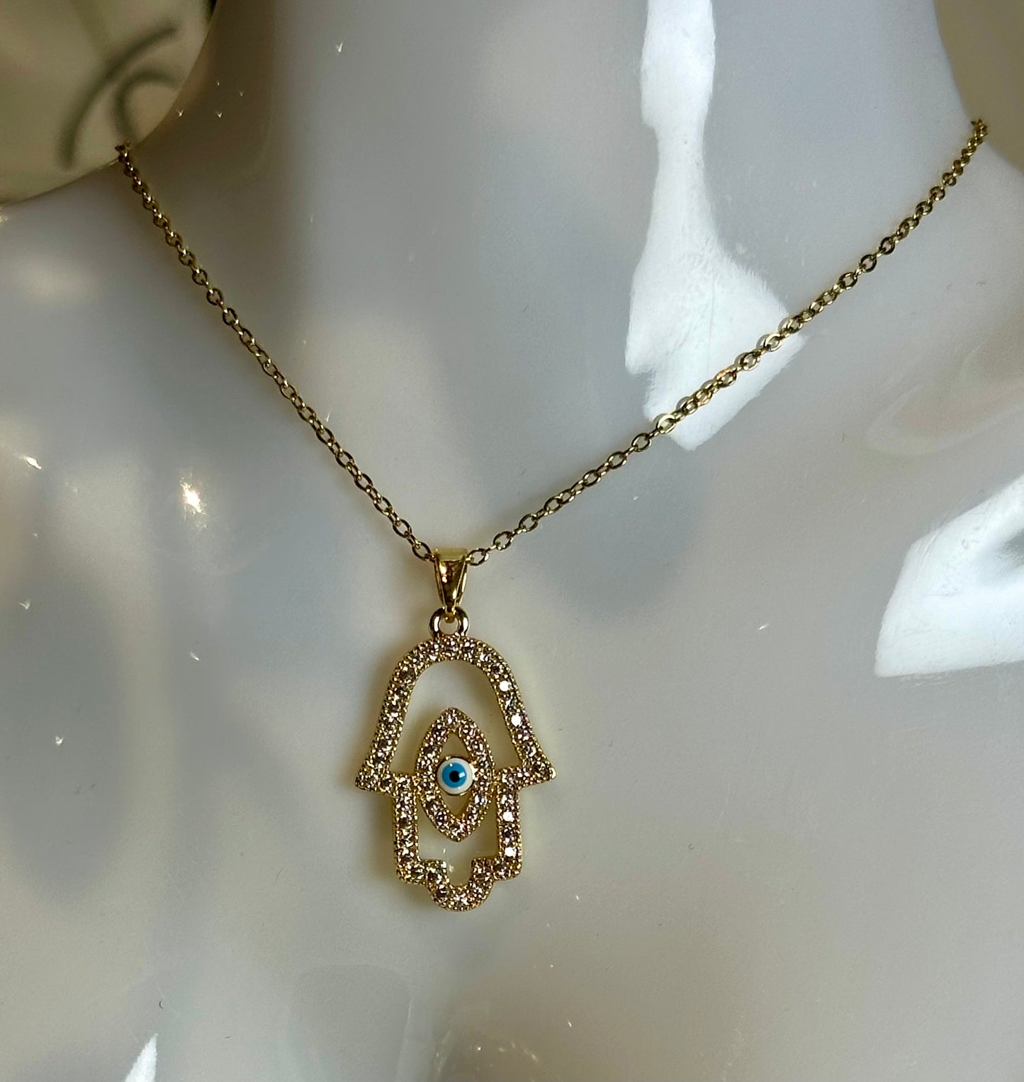 Evil Eye Pendant Necklace in 18K gold and blue on stainless steel chain.