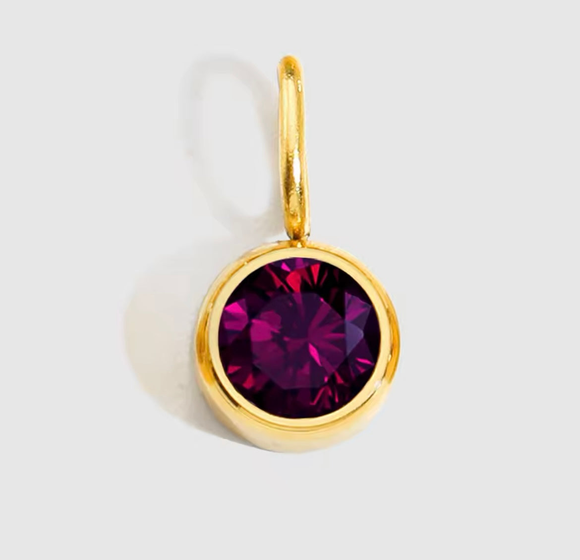 Birthstone Charm Necklace with red birthstone pendant and gold-plated finish.