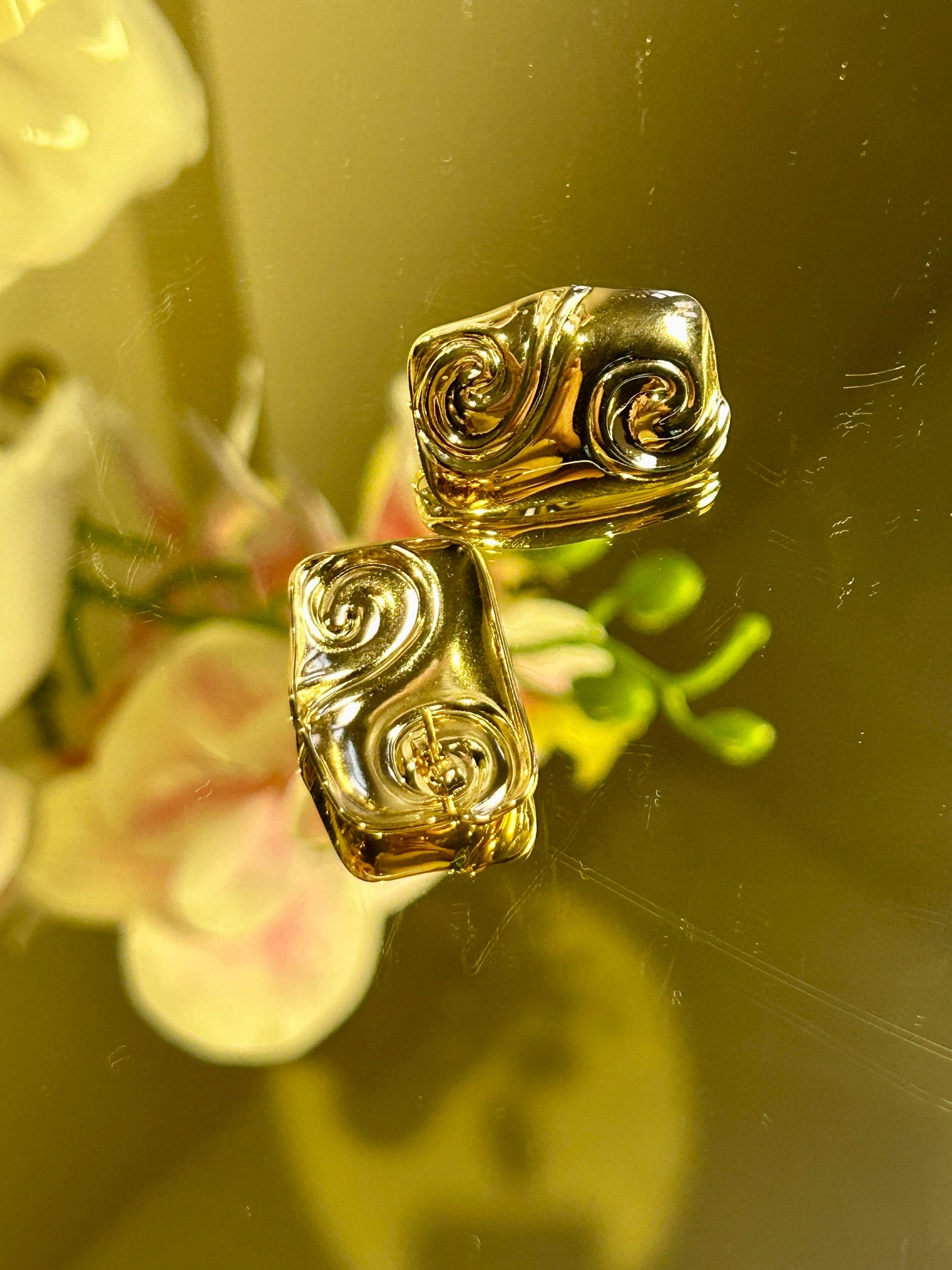 Square Embossed Spiral Earring with 18K gold plating and stainless steel.