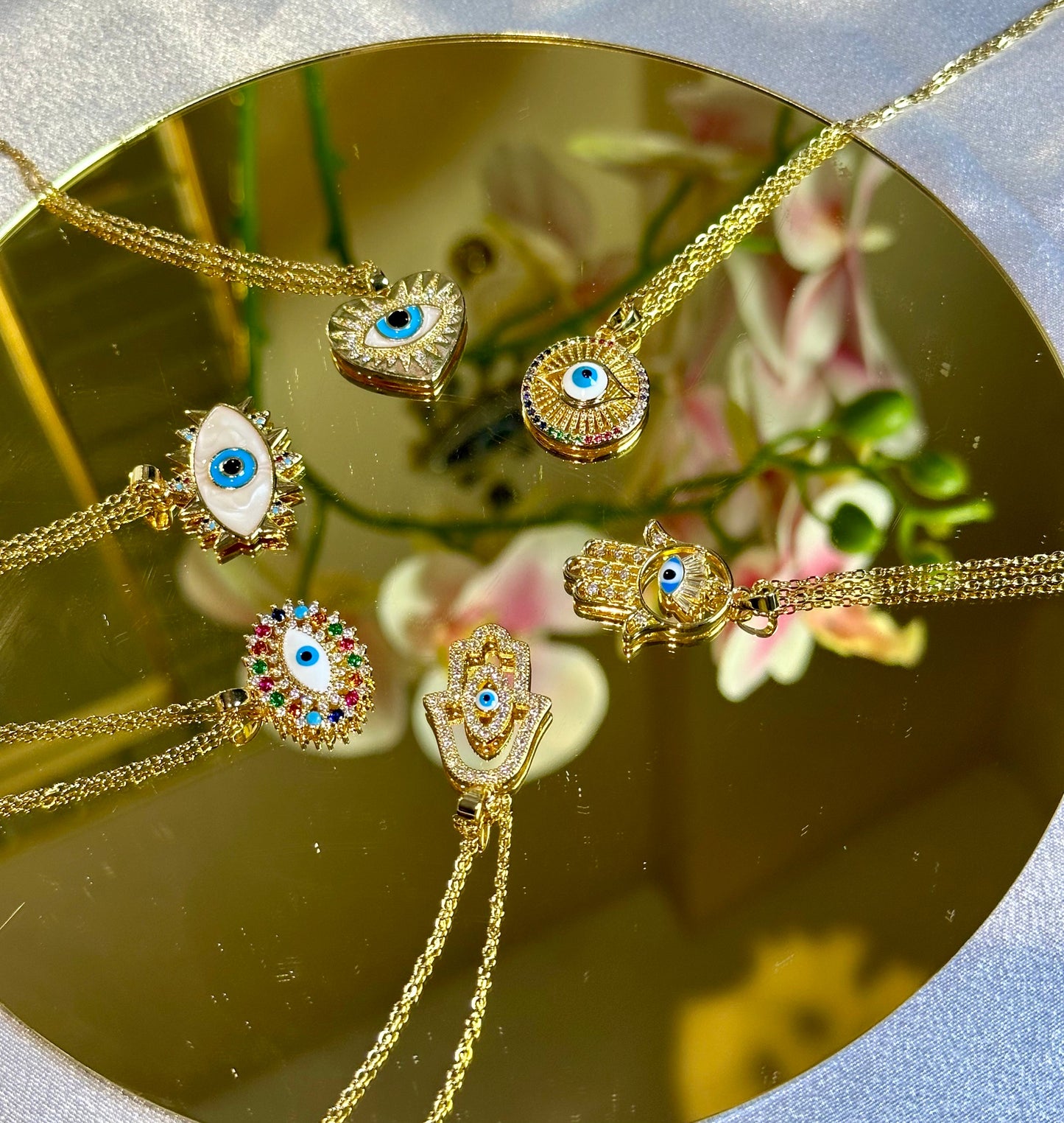 Evil Eye Pendant Necklace with 18K gold and blue design on non-tarnish stainless steel.