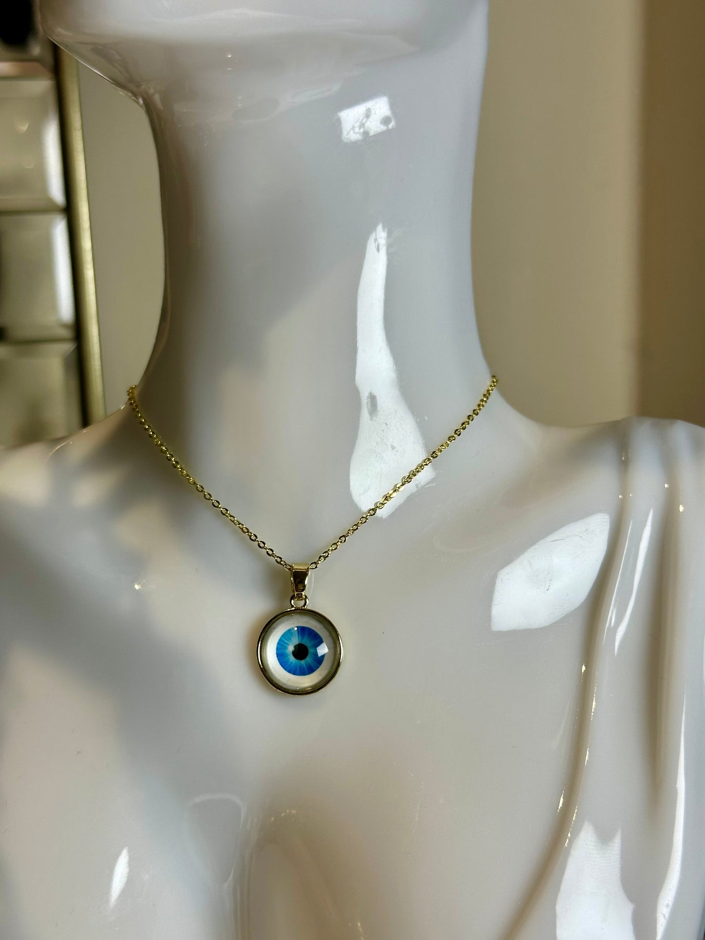 Round Resin Evil Eyes Necklace on gold-plated chain with colorful enamel pendant.