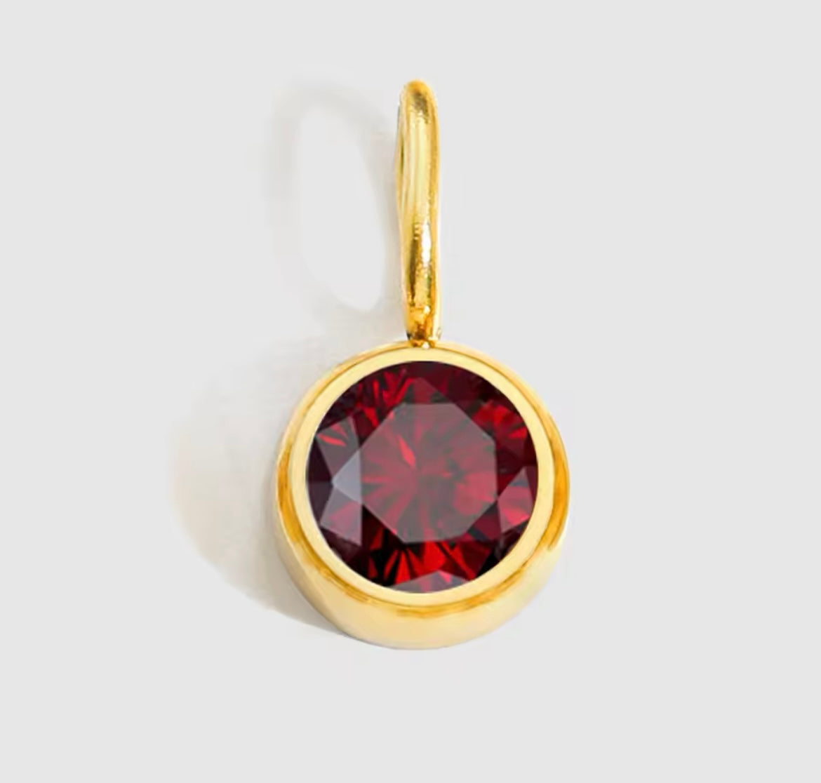 Birthstone Charm Necklace with gold-plated adjustable chain and red birthstone pendant.