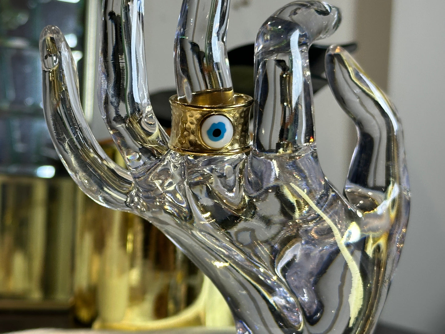 Devil Eye Rings Size 7 in 18K gold plated stainless steel with evil eye design, displayed on clear hand model.