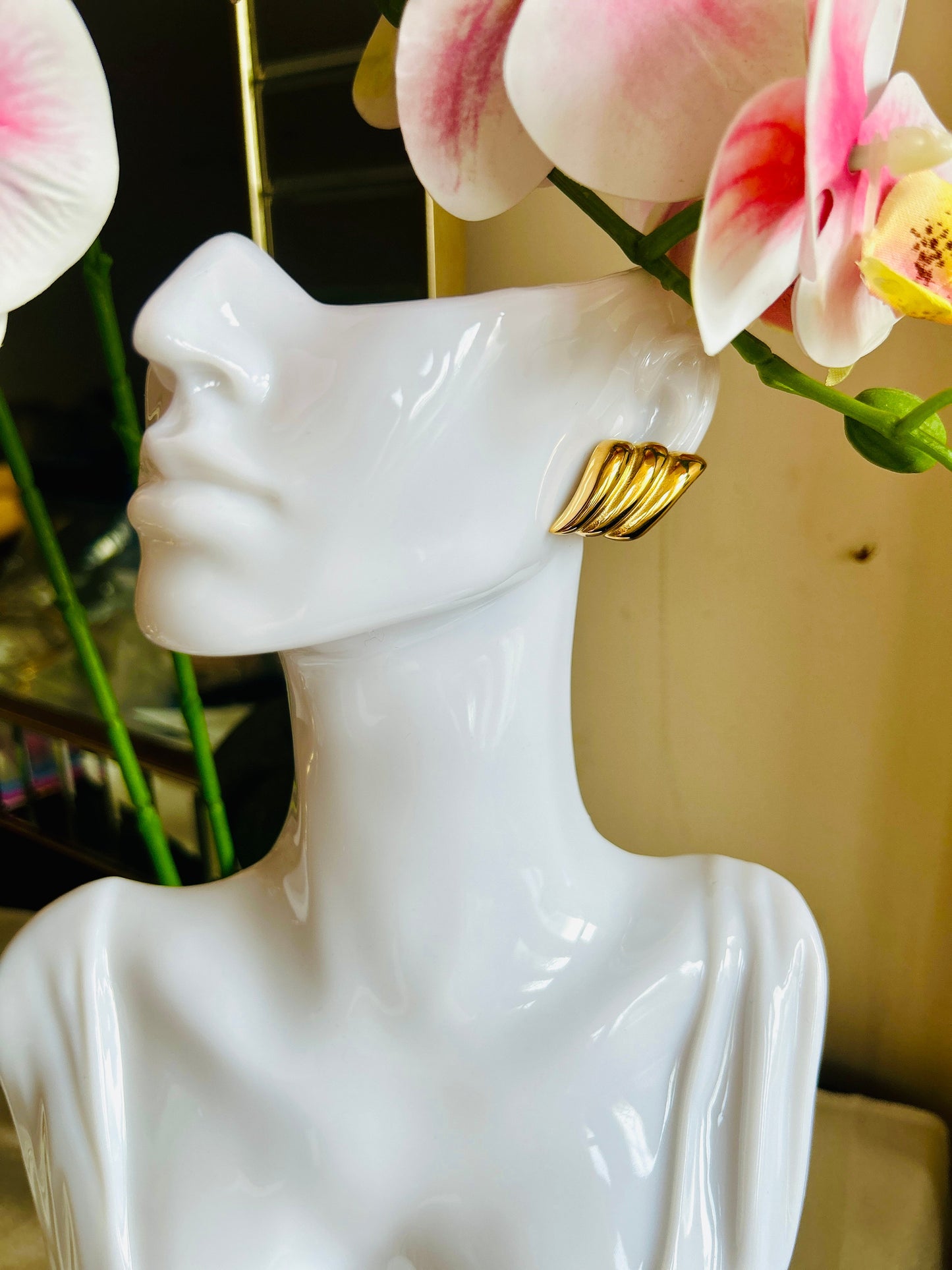 18K gold plated Daily Wing Earring on white mannequin.