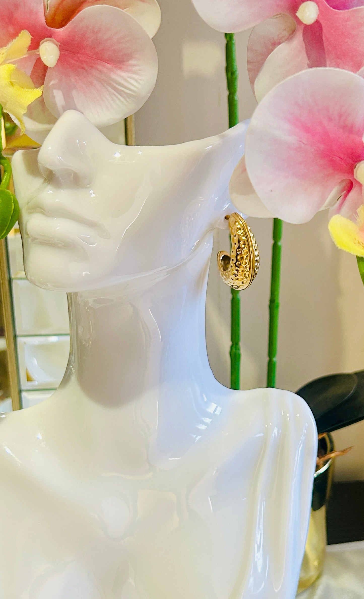 Moon Shape Hammer Earrings in 18k gold on display mannequin.
