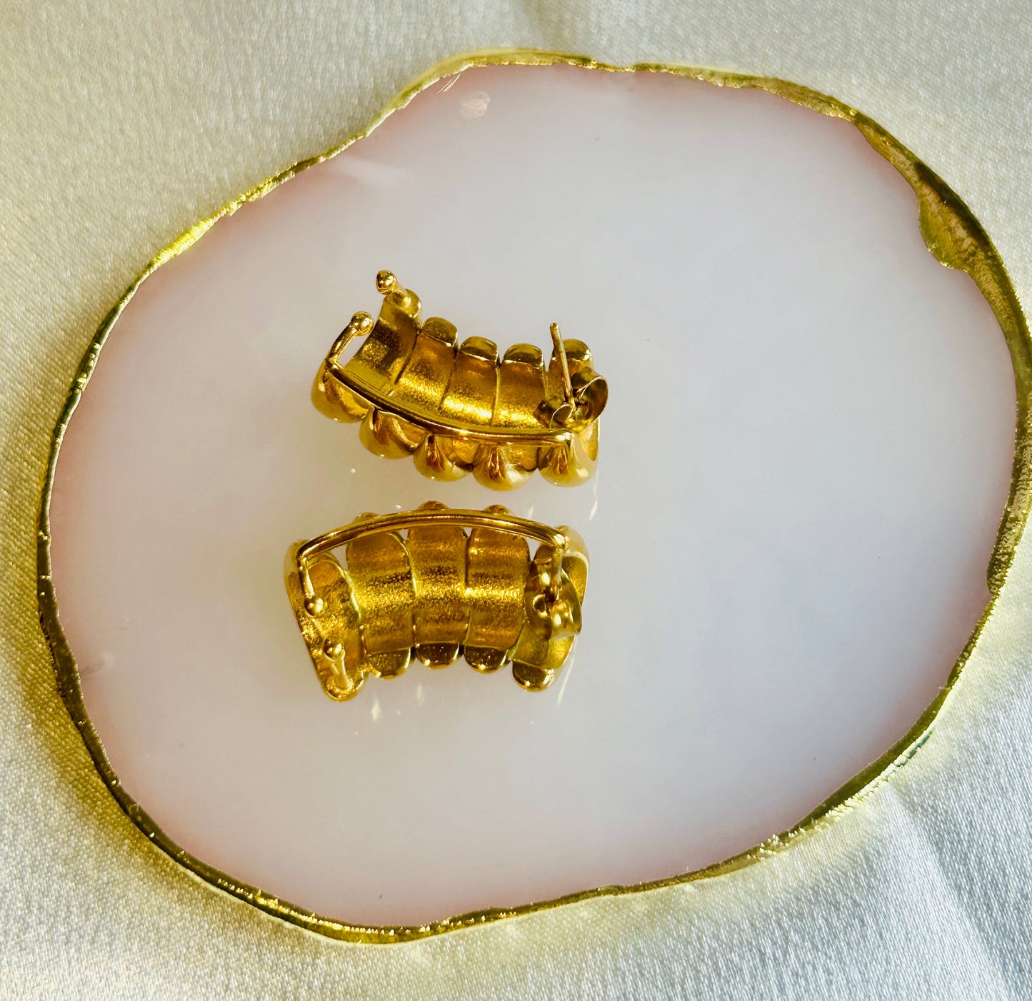 Striped Hollow Women Earring with gold plating on display.