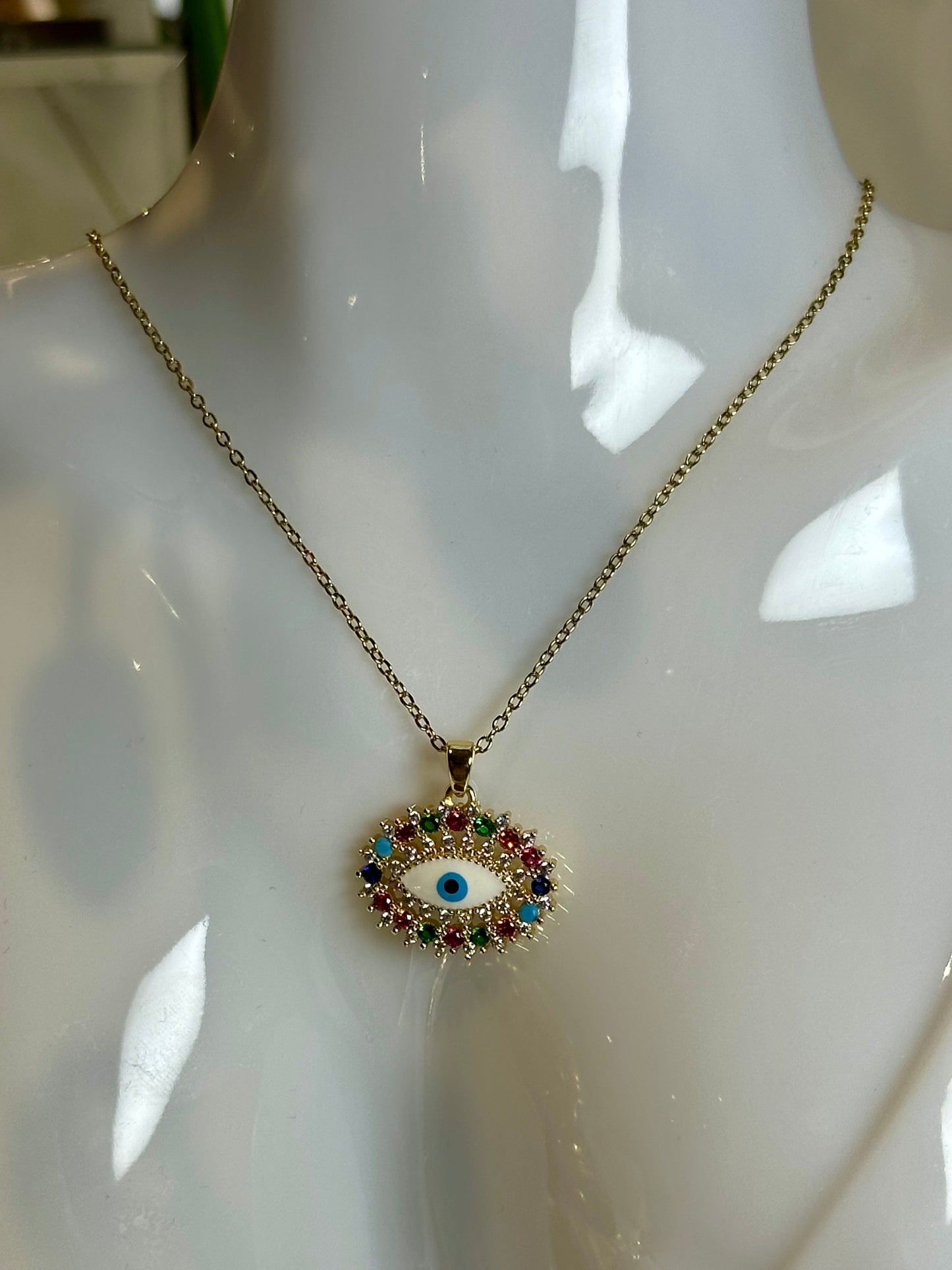 Evil Eye Pendant Necklace in 18K gold and blue design on stainless steel chain.